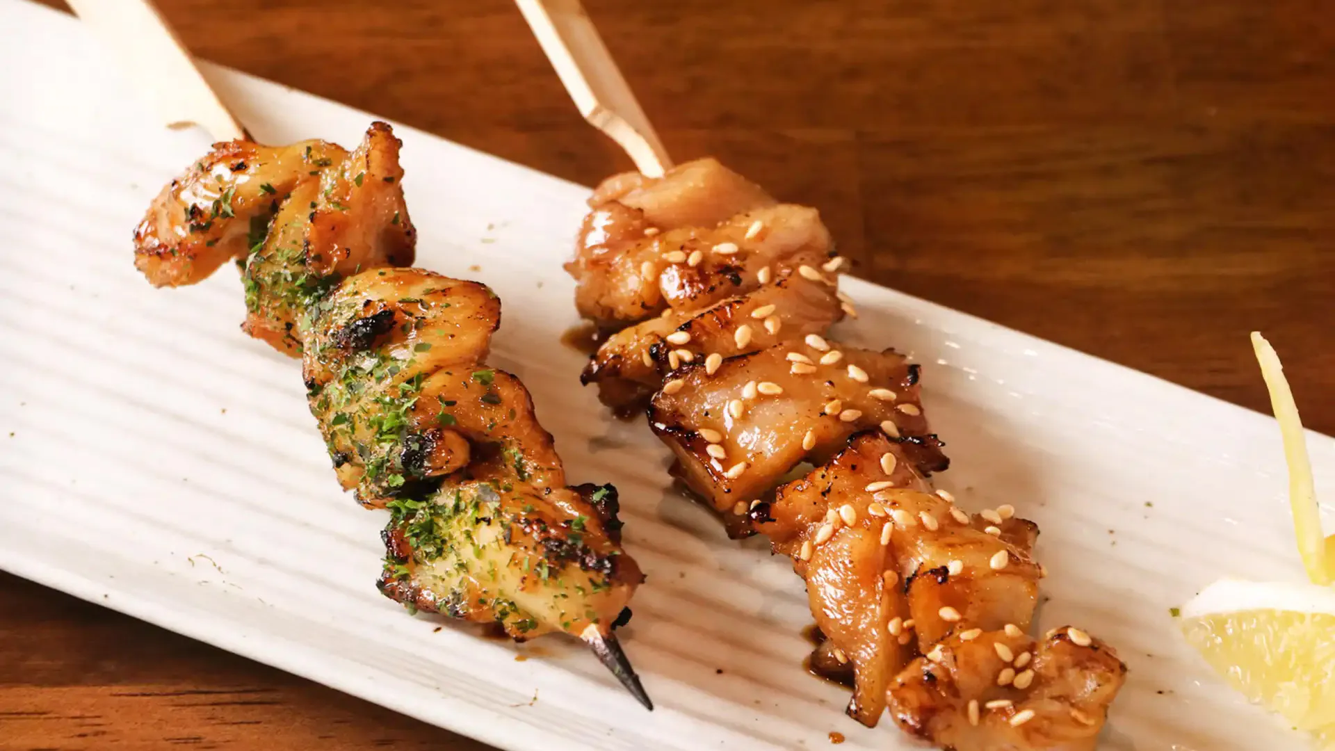 Two kinds of grilled chicken skewers with sesame and herbs at Fujiya Ramen & Yakitori, a Asian Restaurant in Arcadia
